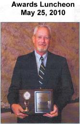 Bob Bondi holding the Eagle Award at the 2010 Small Business Day Awards Luncheon